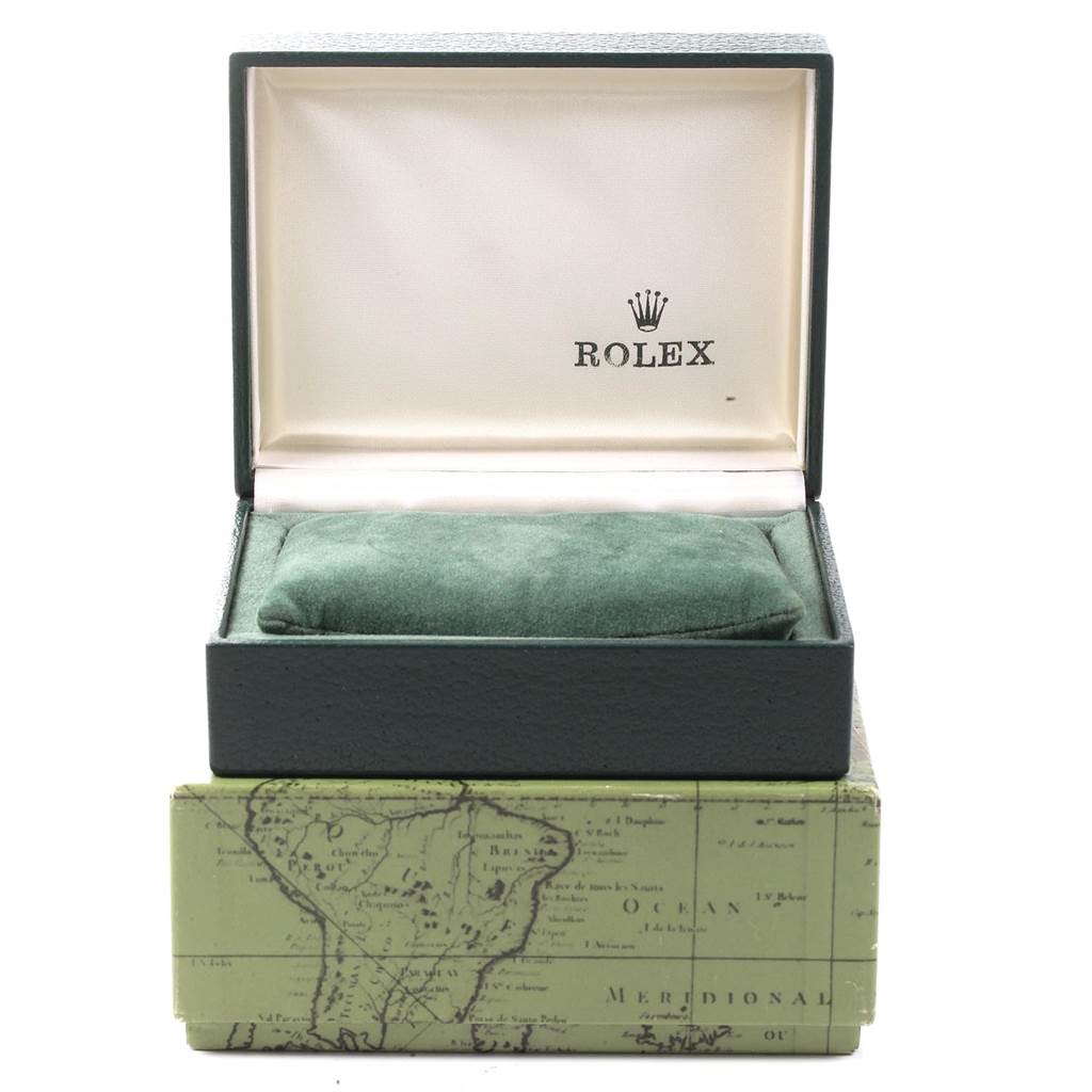 The image shows an open box of a Rolex Mid-Size 67480 Women's Stainless Steel Silver Dial 67480 Women's Stainless Steel Silver Dial model watch, displaying its interior lined with green velvet.