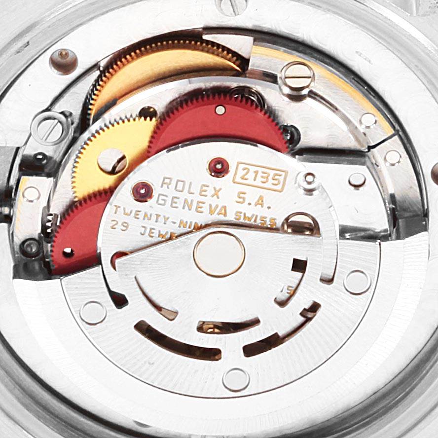 The image shows a close-up view of the Rolex Mid-Size 68273 Women's Steel and Gold (two tone) Champagne Dial 68273 Women's Steel and Gold (two tone) Champagne Dial model's movement and internal mechanism.