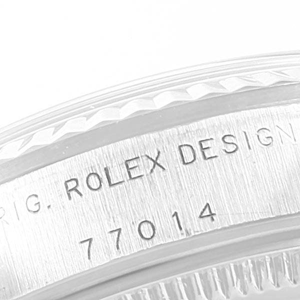 The image shows a close-up of the side of a Mid-Size Rolex watch, focusing on its engraved case design and serial number.