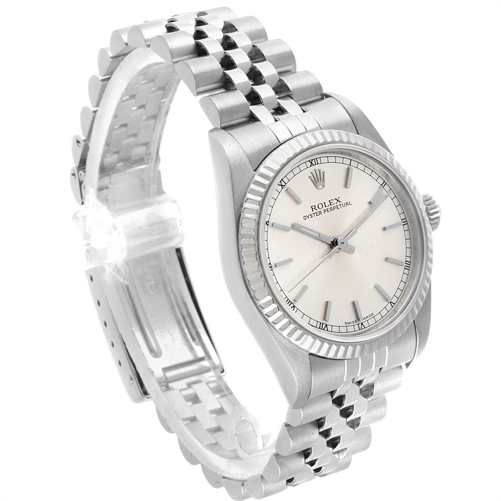 The image shows a Rolex Oyster Perpetual Mid-Size model at an angle displaying its face, bezel, and bracelet.