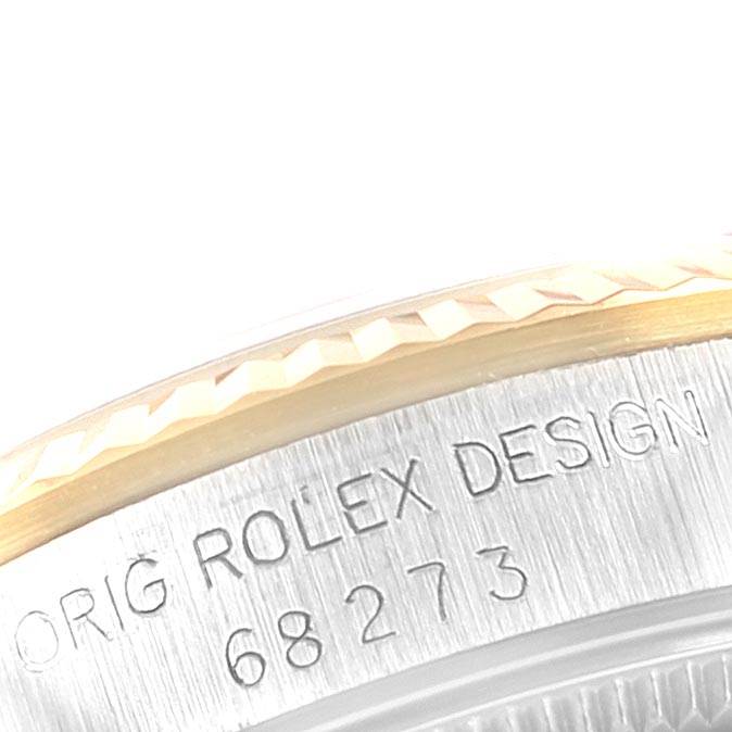 This image shows a close-up of the side view where the bezel and casing of a mid-size Rolex model 68273 are visible.