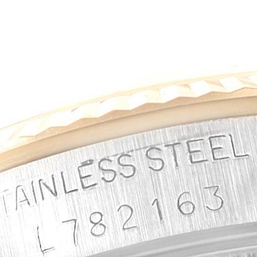 This image shows a close-up of the rim and serial number engraving on a stainless steel Rolex Mid-Size 68273 Women's Steel and Gold (two tone) Blue Dial 68273 Women's Steel and Gold (two tone) Blue Dial model watch.