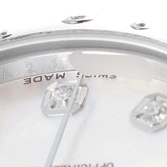 Close-up angle of the dial and bezel of a Mid-Size Rolex watch, showing part of the "Swiss Made" text and markers.