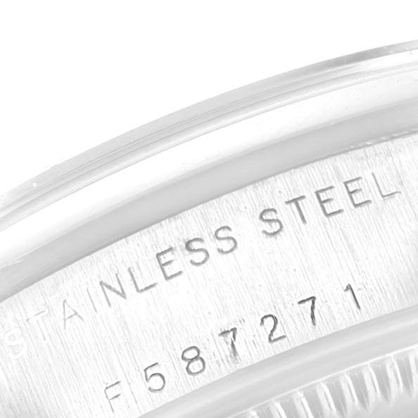 This image shows a close-up of the stainless steel case and serial number of a Rolex Mid-Size 78240 Women's Stainless Steel White Dial 78240 Women's Stainless Steel White Dial model watch.