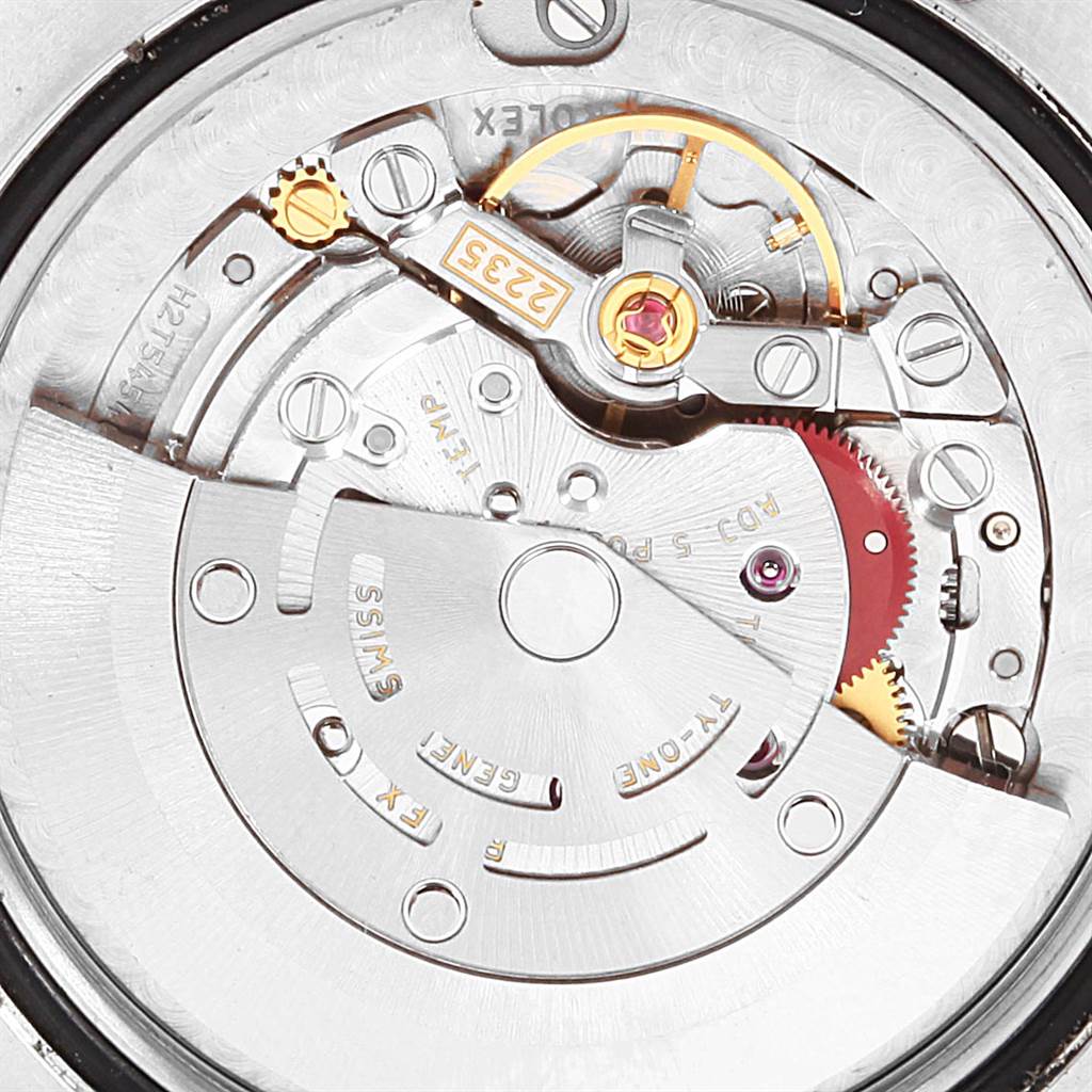 The image shows a close-up of the movement mechanism inside a Rolex Mid-Size 178384 Women's Stainless Steel Mother of Pearl Dial 178384 Women's Stainless Steel Mother of Pearl Dial watch, highlighting gears and intricate details.