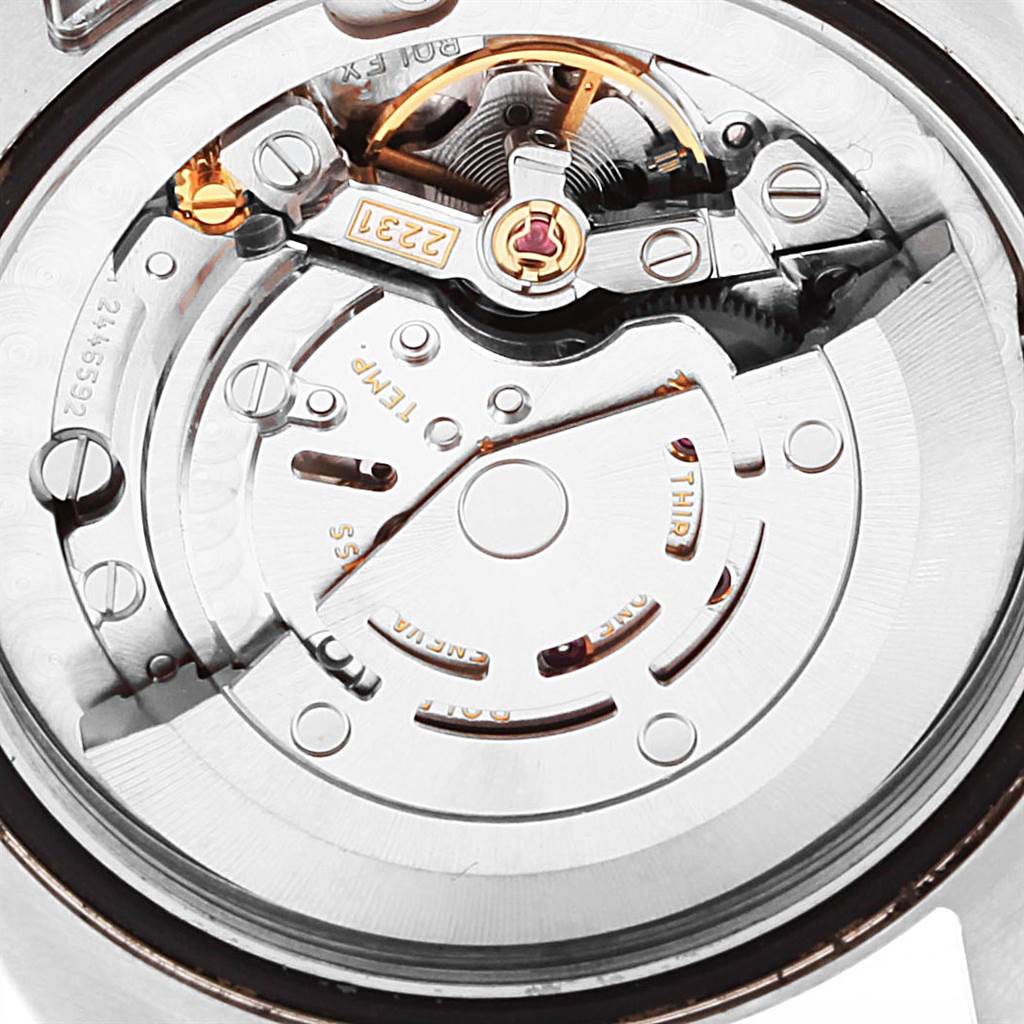 This image shows the movement and inner mechanism of the Mid-Size Rolex watch from a close-up angle.