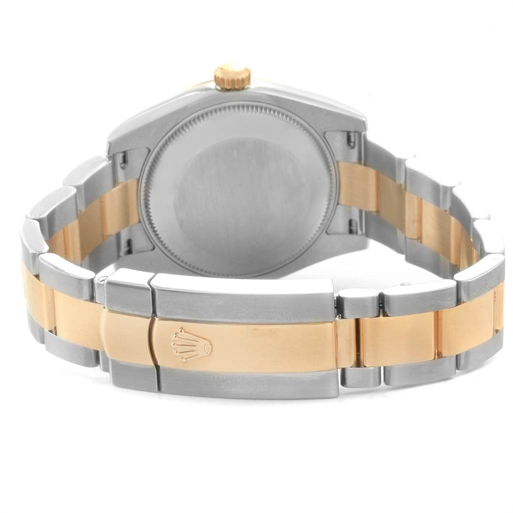 This image shows the back case and bracelet of a Mid-Size Rolex watch, highlighting its two-tone design and clasp with the Rolex logo.