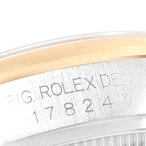 The image shows a close-up view of the case side of a Mid-Size Rolex watch, highlighting part of the model number engraving.