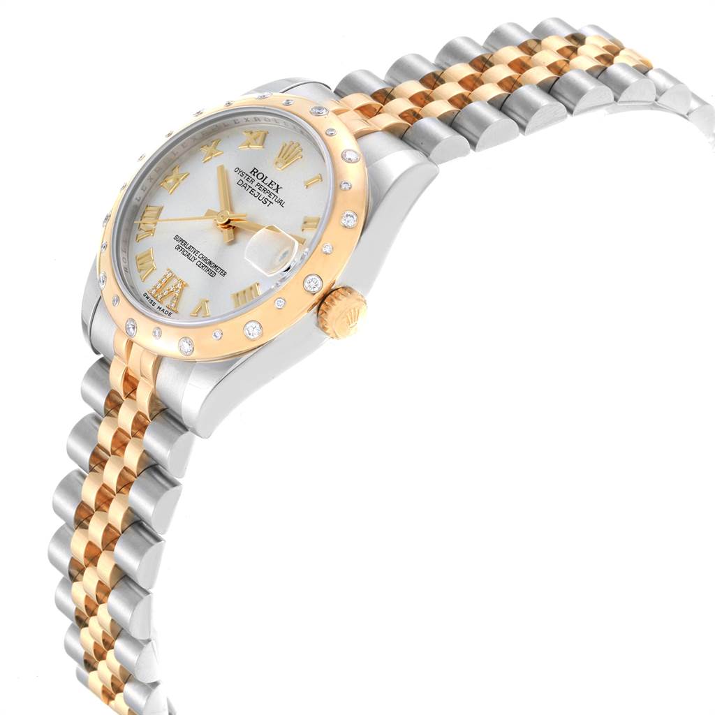 The image shows a Rolex Mid-Size 178343 Women's Steel and Gold (two tone) Silver Dial 178343 Women's Steel and Gold (two tone) Silver Dial watch from a side angle, highlighting its two-tone bracelet and diamond-set bezel.