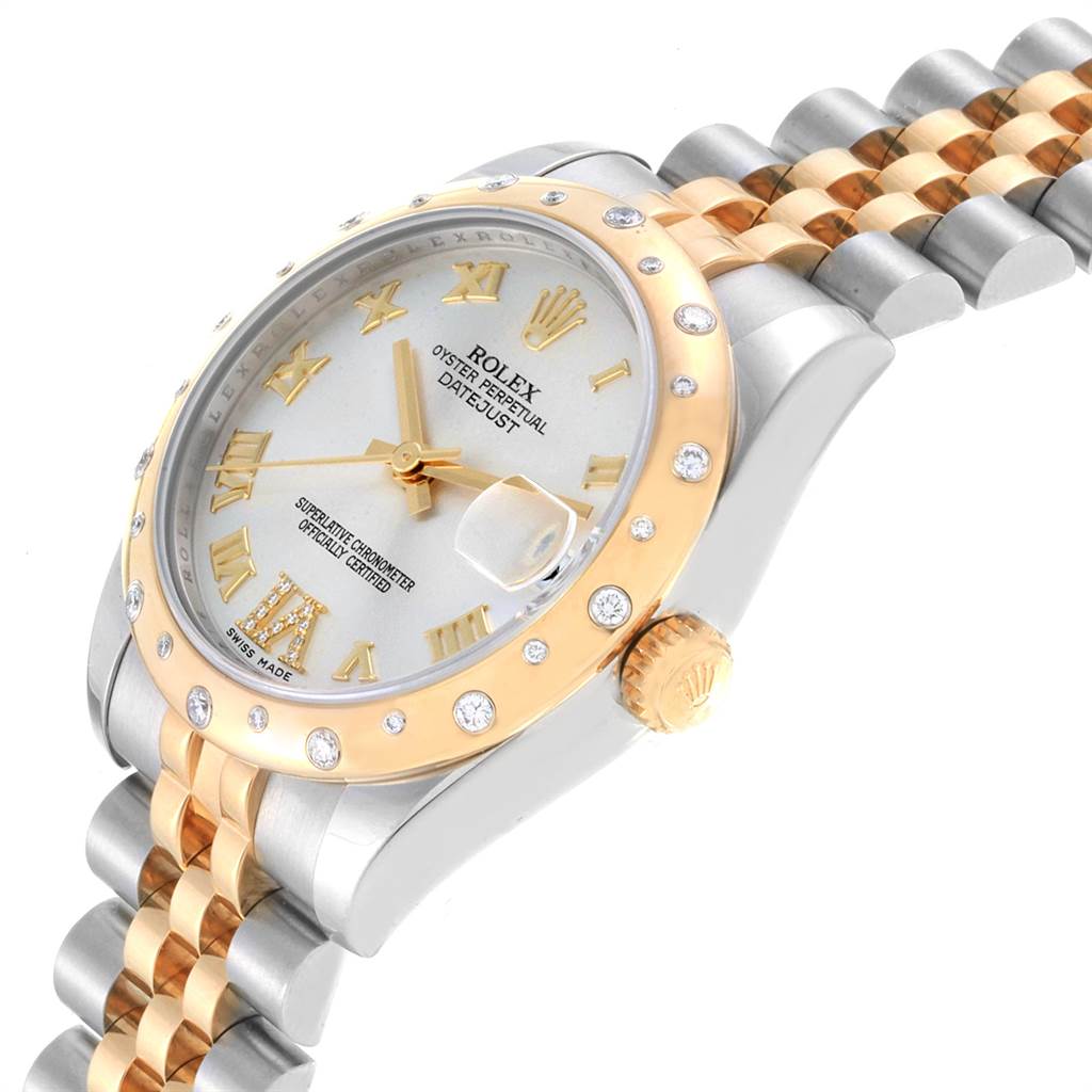 The image shows a close-up, angled view of the Rolex Mid-Size 178343 Women's Steel and Gold (two tone) Silver Dial 178343 Women's Steel and Gold (two tone) Silver Dial model watch's face, bezel, crown, and bracelet.