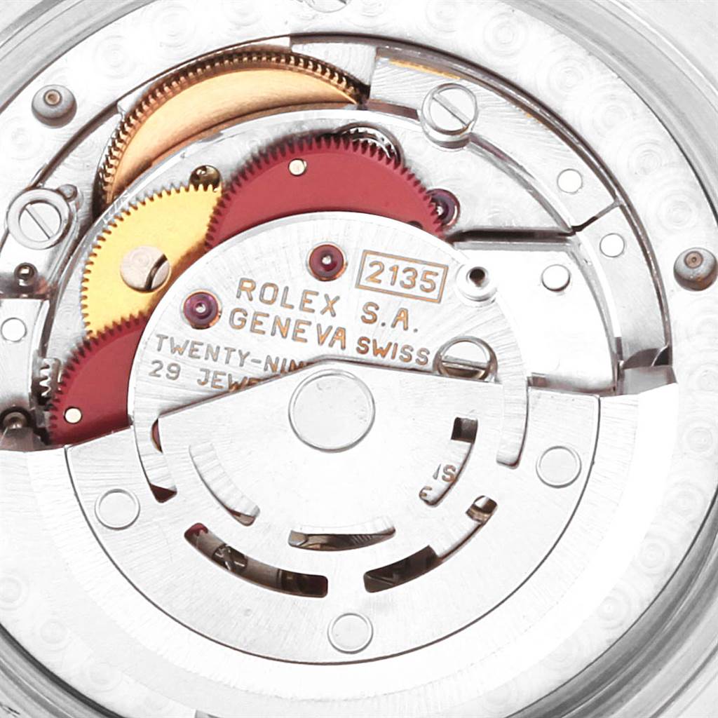 This image shows the internal mechanism of a Rolex Mid-Size 68273 Women's Steel and Gold (two tone) Blue Dial 68273 Women's Steel and Gold (two tone) Blue Dial model watch, highlighting its movement and gears.