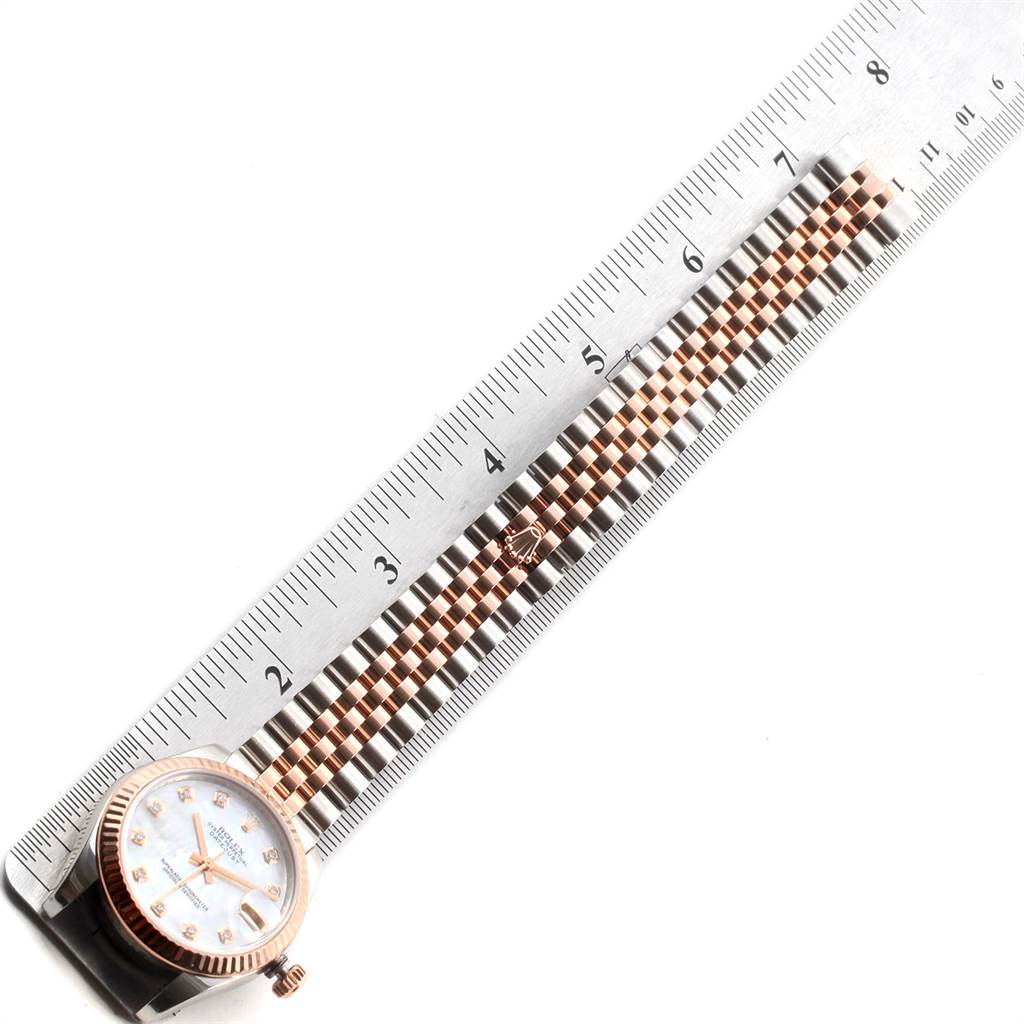 The image shows a Rolex Mid-Size 178271 Women's Steel and Gold (two tone) Mother of Pearl Dial 178271 Women's Steel and Gold (two tone) Mother of Pearl Dial watch lying flat, with the face and band measured against a ruler.