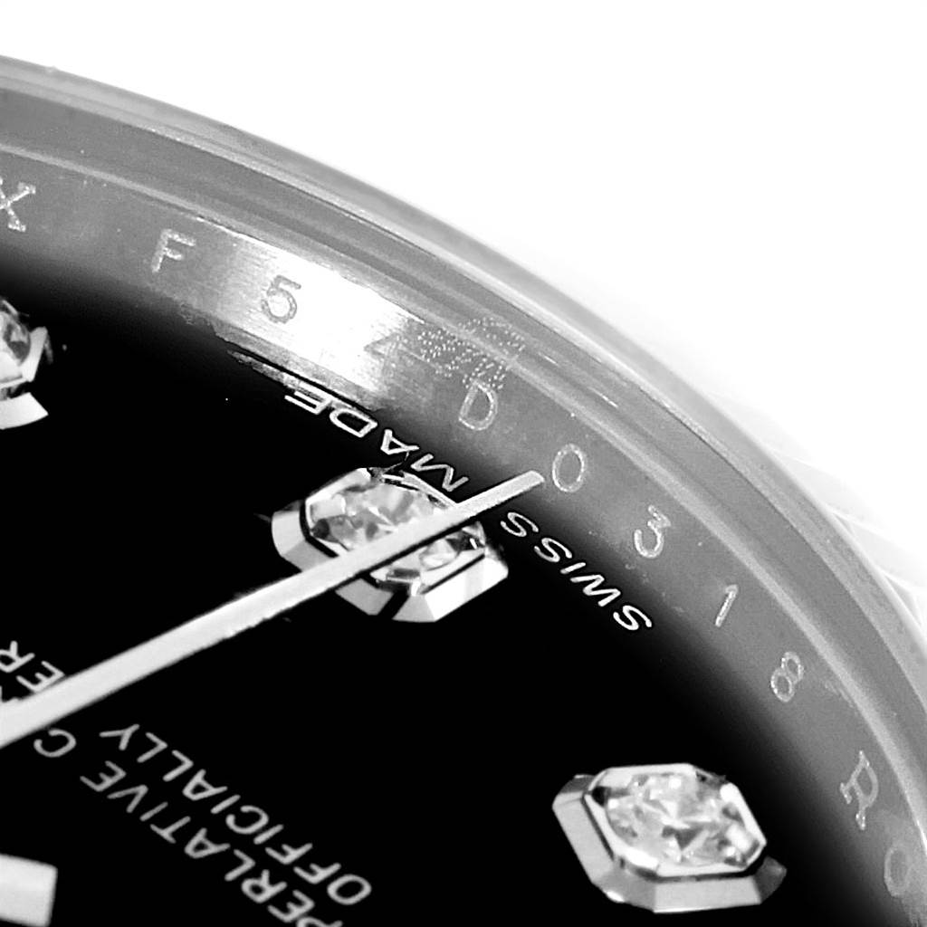 The close-up angle shows the edge of the dial, diamond markers, and part of the bezel of the Rolex Mid-Size 178274 Women's Stainless Steel Black Dial 178274 Women's Stainless Steel Black Dial model watch.