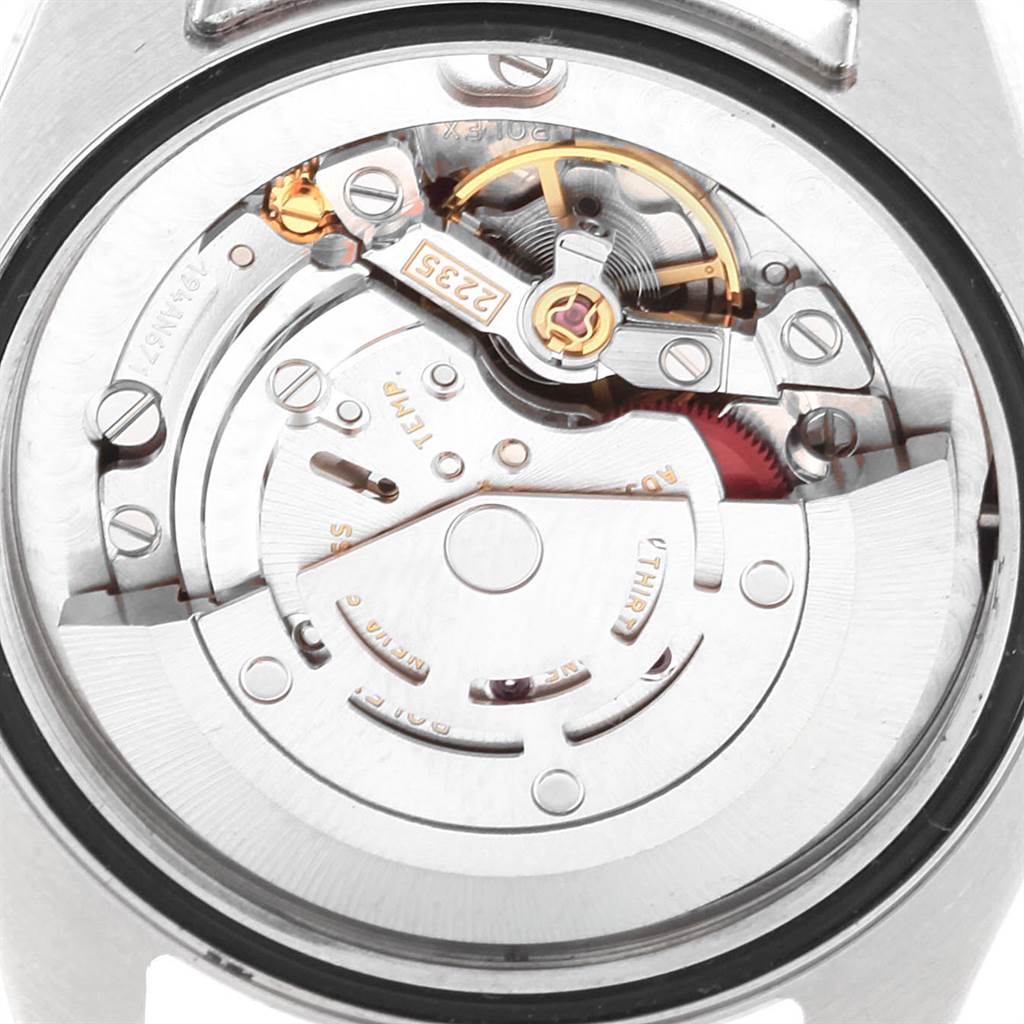 The image shows the movement mechanism of a Mid-Size Rolex watch from the back.