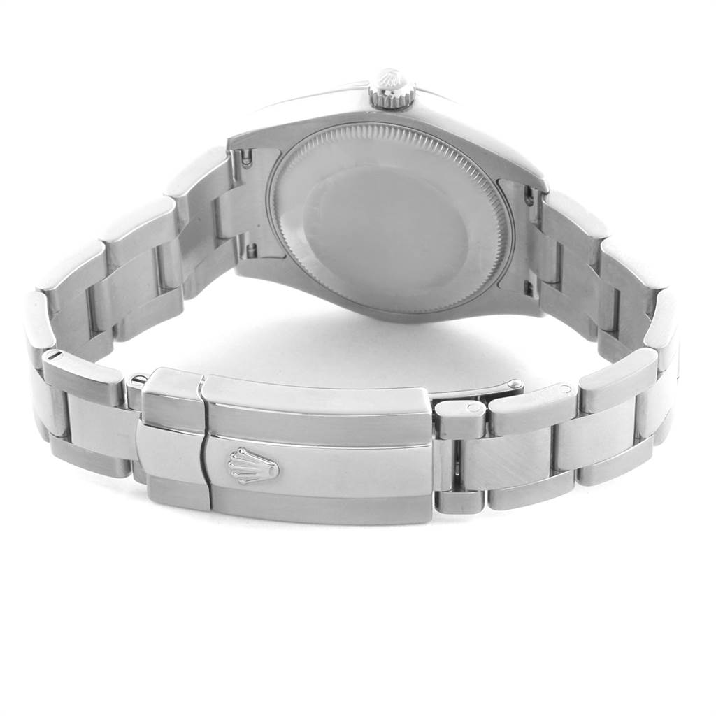 This image shows the back view of the case and the closed clasp of a Mid-Size Rolex watch.