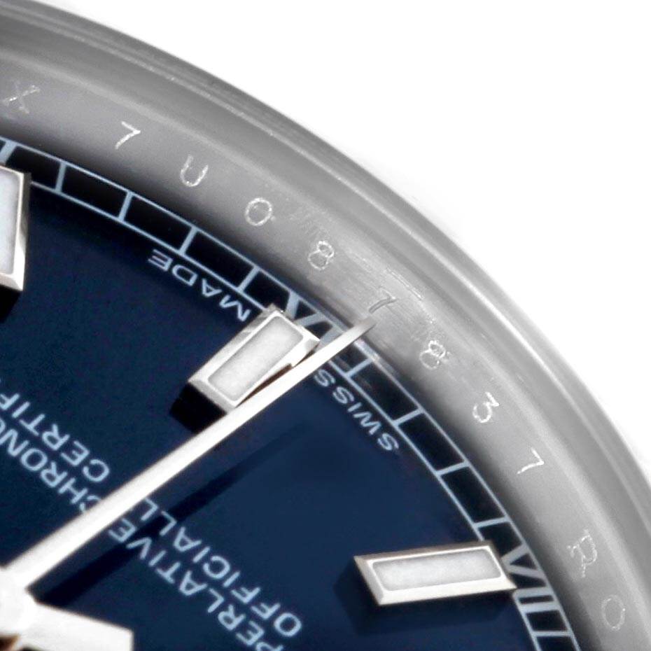 The image shows a close-up of the dial and second hand of a Rolex Mid-Size 178274 Women's Stainless Steel Blue Dial 178274 Women's Stainless Steel Blue Dial model, highlighting the indices and part of the bezel.