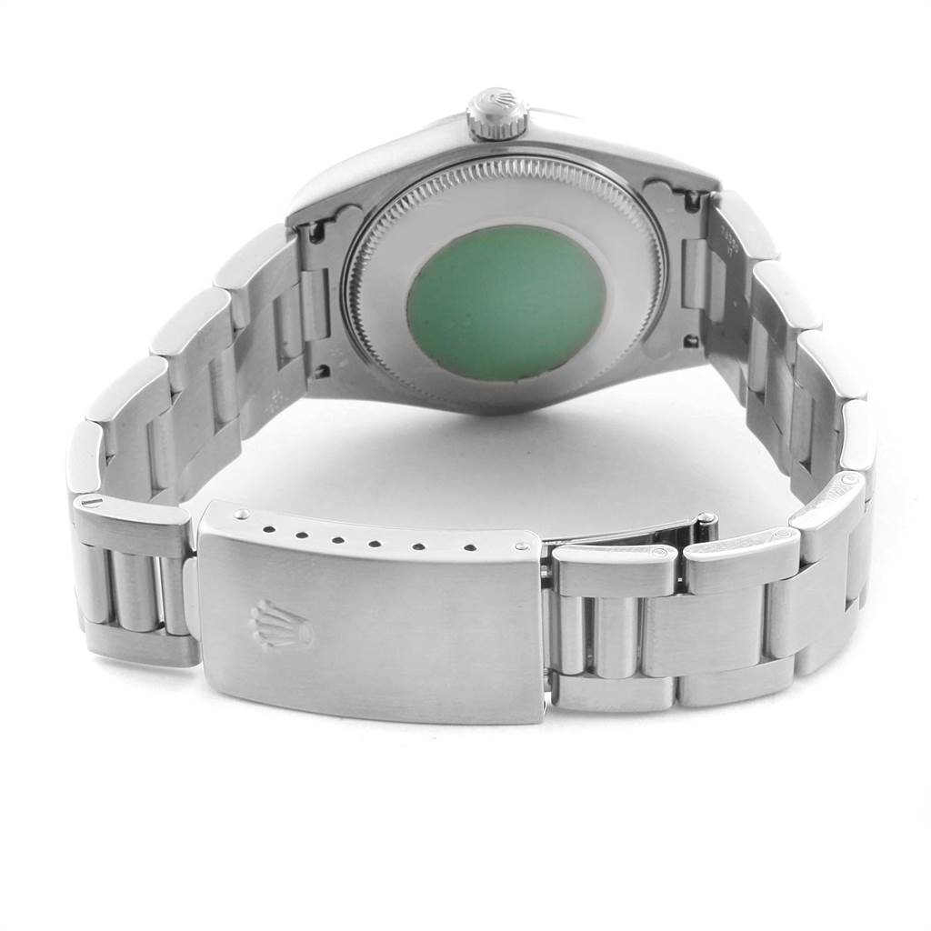 The image shows the back view of a Rolex Mid-Size 77080 Women's Stainless Steel Pink Dial 77080 Women's Stainless Steel Pink Dial model watch, highlighting the case back, crown, and bracelet with clasp.