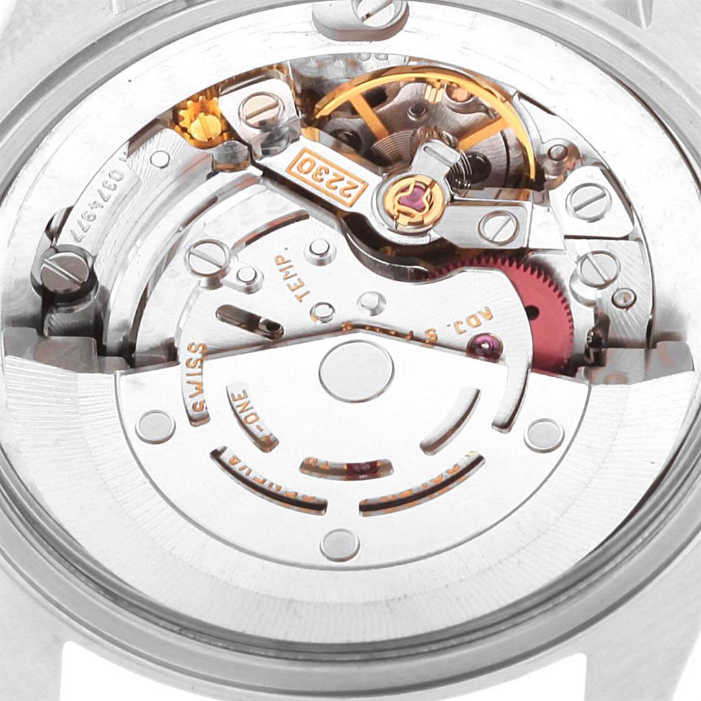 The image shows the intricate inner workings of the Rolex Mid-Size 77080 Women's Stainless Steel Pink Dial 77080 Women's Stainless Steel Pink Dial model watch from a back angle.