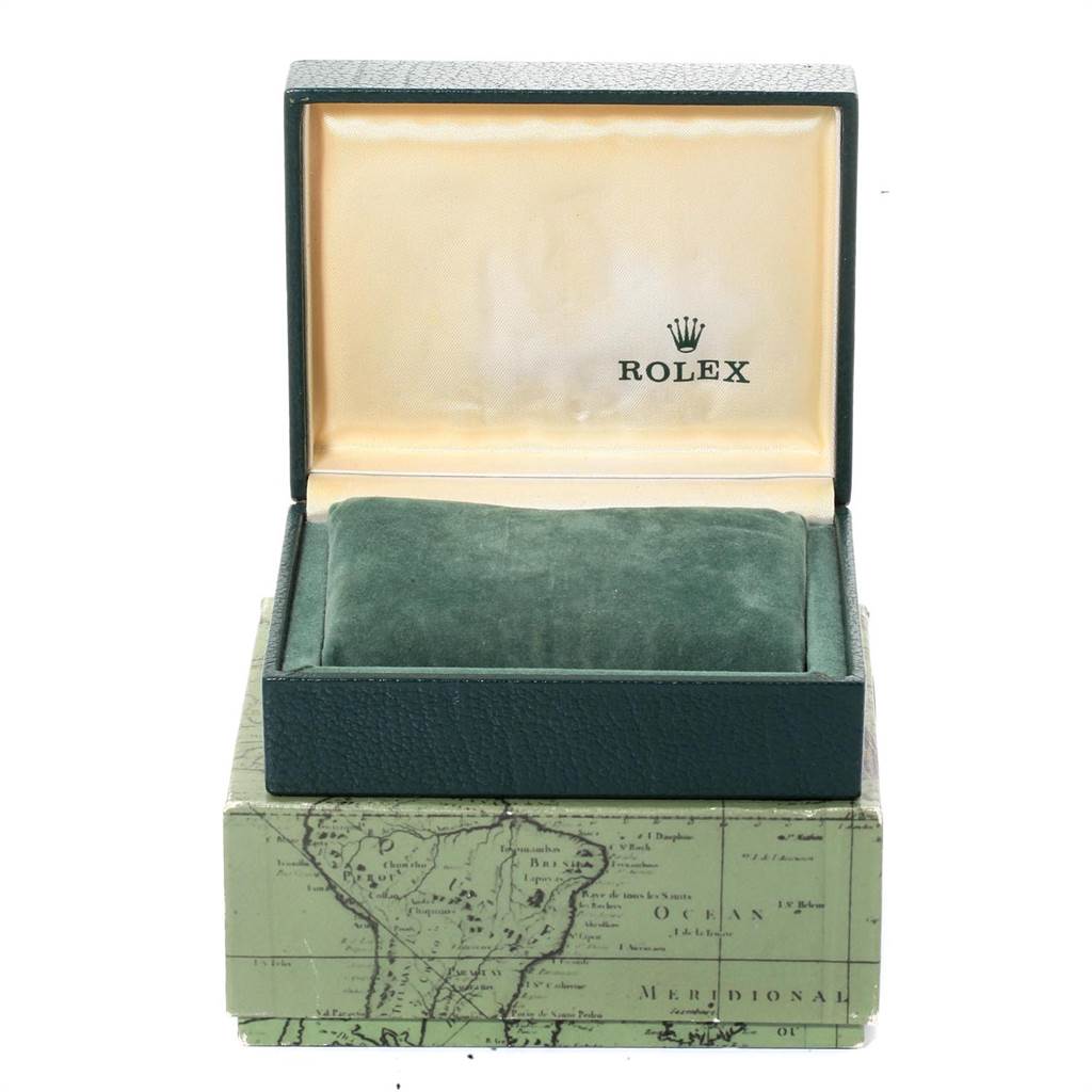 This image shows the open box of a Mid-Size Rolex watch, displaying its interior and cushion, with the exterior partially visible.