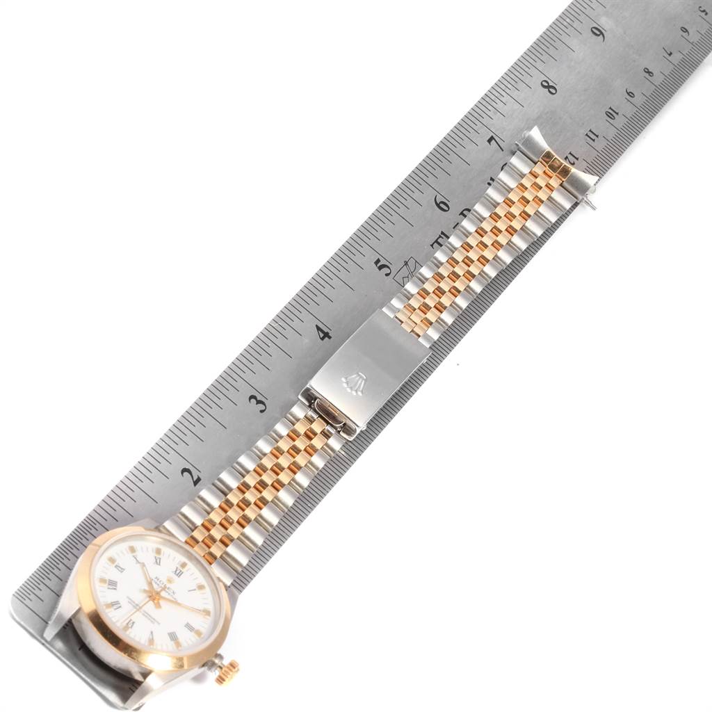 The Rolex Mid-Size 67513 Women's Steel and Gold (two tone) White Dial 67513 Women's Steel and Gold (two tone) White Dial model watch is shown from a top-down angle, displaying the face, bezel, crown, bracelet, and clasp.