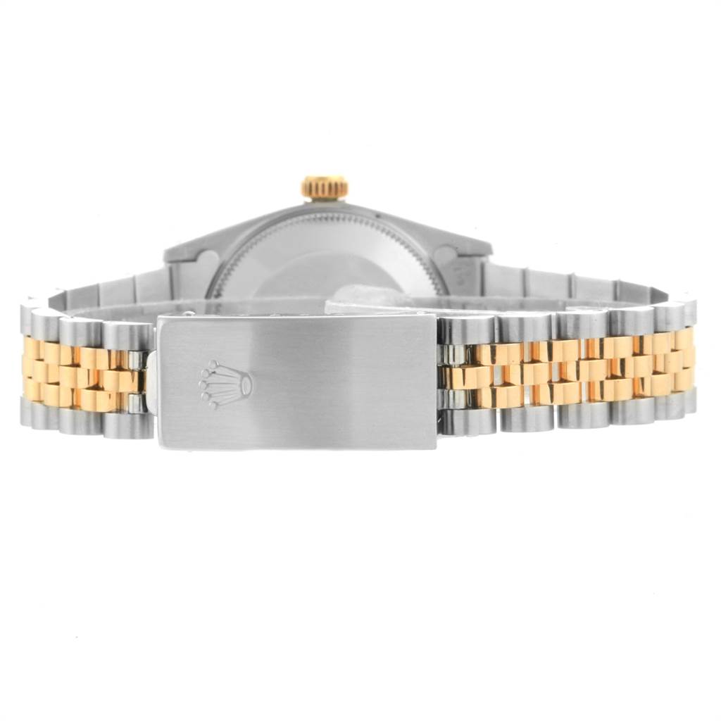 The image shows the back of a Rolex Mid-Size 67513 Women's Steel and Gold (two tone) White Dial 67513 Women's Steel and Gold (two tone) White Dial model watch, highlighting its two-tone bracelet and clasp with the Rolex logo.