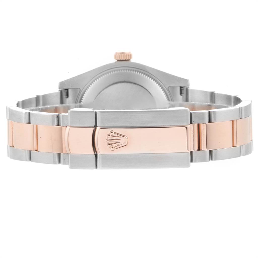 The image shows the back view of a Mid-Size Rolex watch, highlighting its two-tone bracelet and clasp with the Rolex logo.