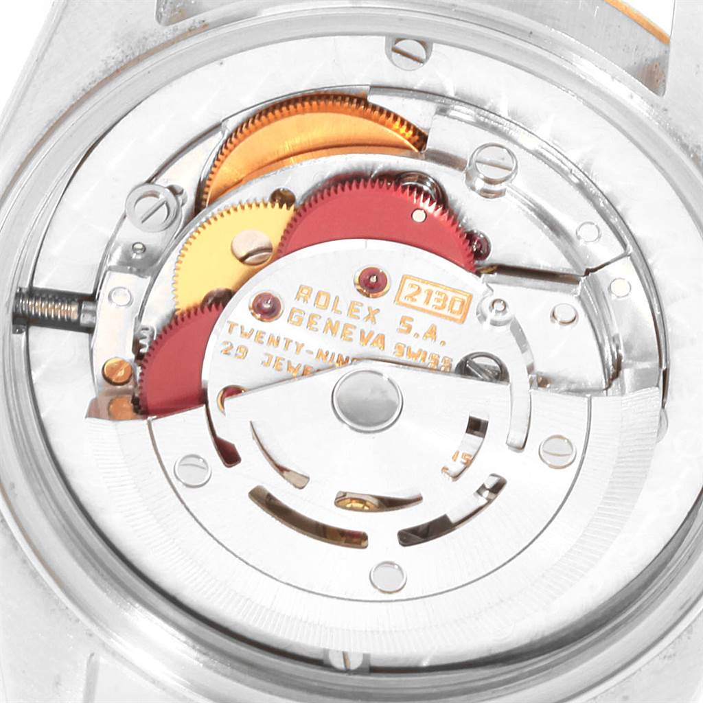 The image shows the internal mechanism and movement of a Mid-Size Rolex watch viewed from the back.