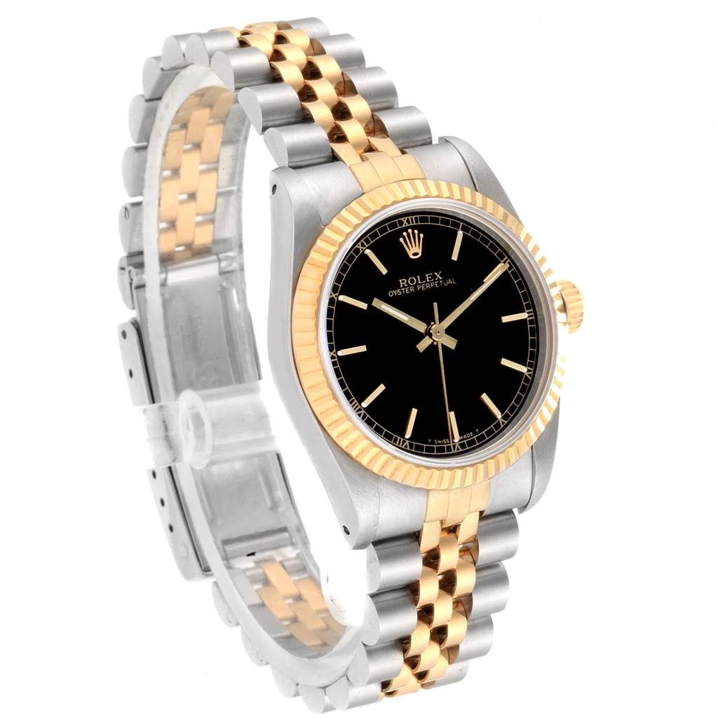 The Rolex Mid-Size 67513 Women's Steel and Gold (two tone) Black Dial 67513 Women's Steel and Gold (two tone) Black Dial model watch is shown at an angle displaying the black dial, gold bezel, and two-tone metal bracelet.