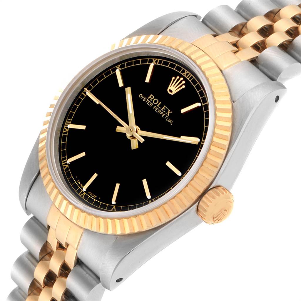 The image shows a Rolex Oyster Perpetual Mid-Size watch at a three-quarter angle, highlighting the bezel, dial, and part of the bracelet.