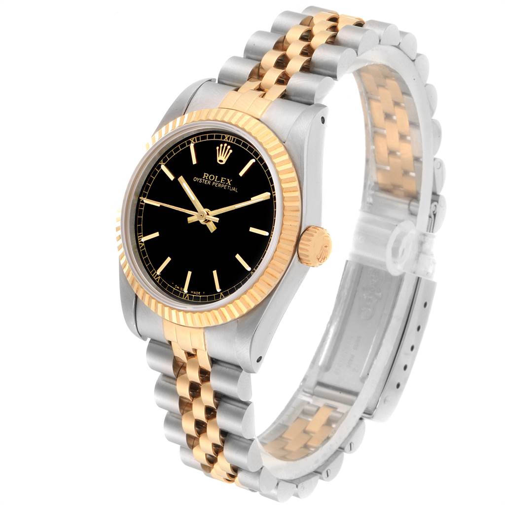 The Rolex Mid-Size 67513 Women's Steel and Gold (two tone) Black Dial 67513 Women's Steel and Gold (two tone) Black Dial watch is shown at a front angle, displaying its black dial, gold bezel, and two-tone bracelet.