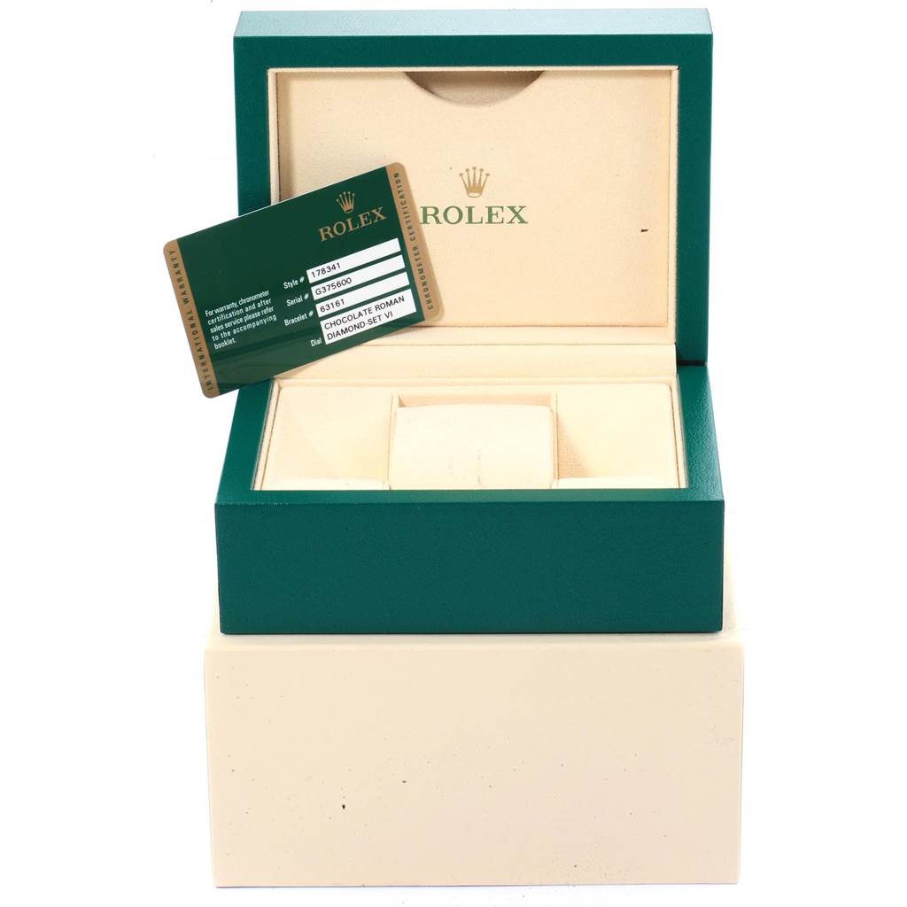 The image shows an open Rolex watch box for a Mid-Size model, with a warranty card displayed on top.