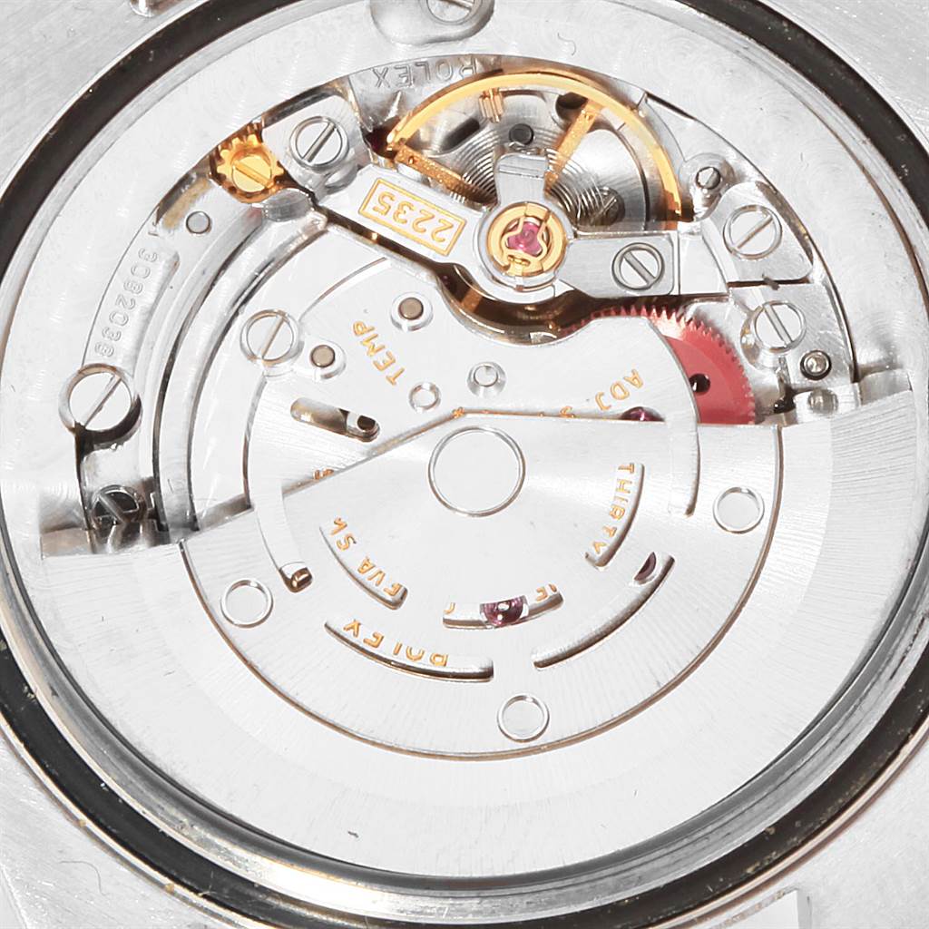 The image shows the internal mechanism and movement of a Mid-Size Rolex watch, viewed from the back.