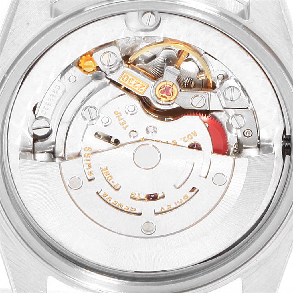 The image shows the movement and internal mechanics of a Rolex Mid-Size 77080 Women's Stainless Steel Pink Dial 77080 Women's Stainless Steel Pink Dial model watch from the back.