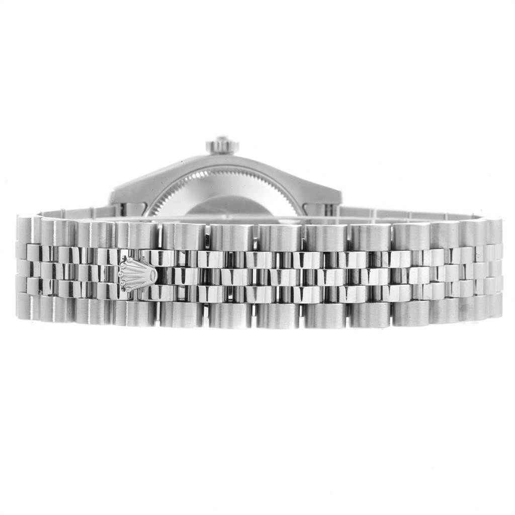 This image shows the back side of the case and the bracelet of a mid-size Rolex watch.