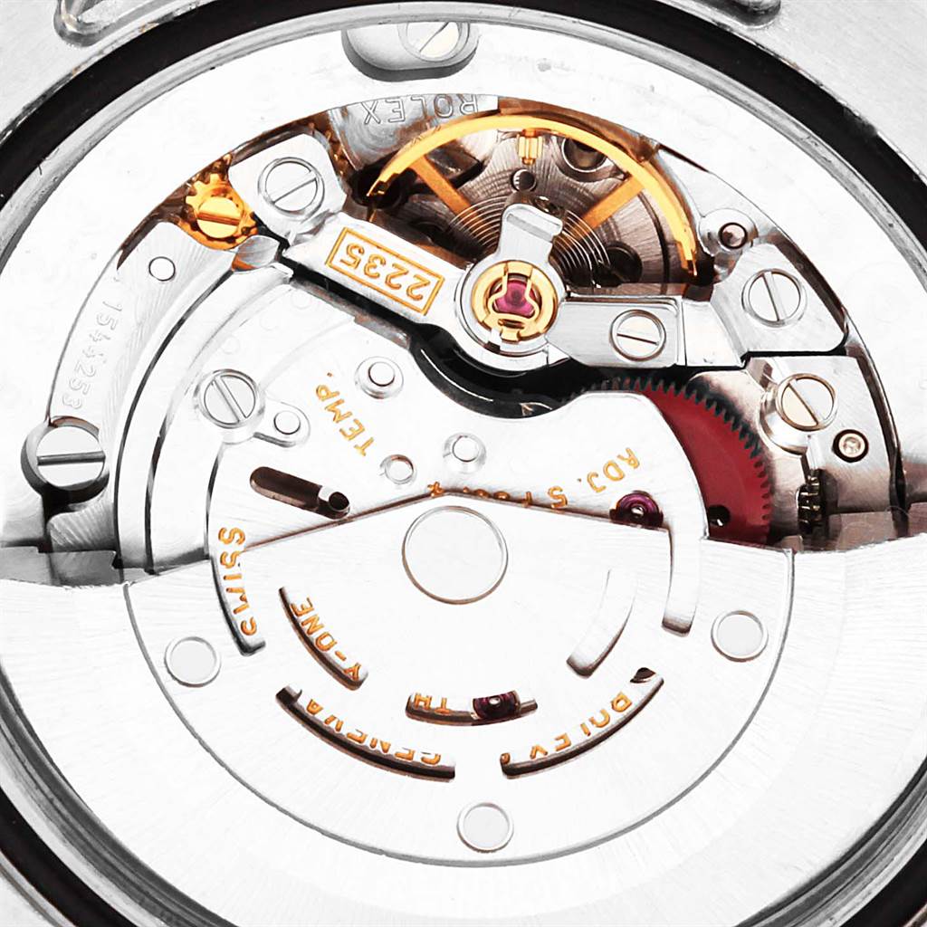 This image shows the internal mechanics and movement of a Mid-Size Rolex watch, highlighting gears and other components.