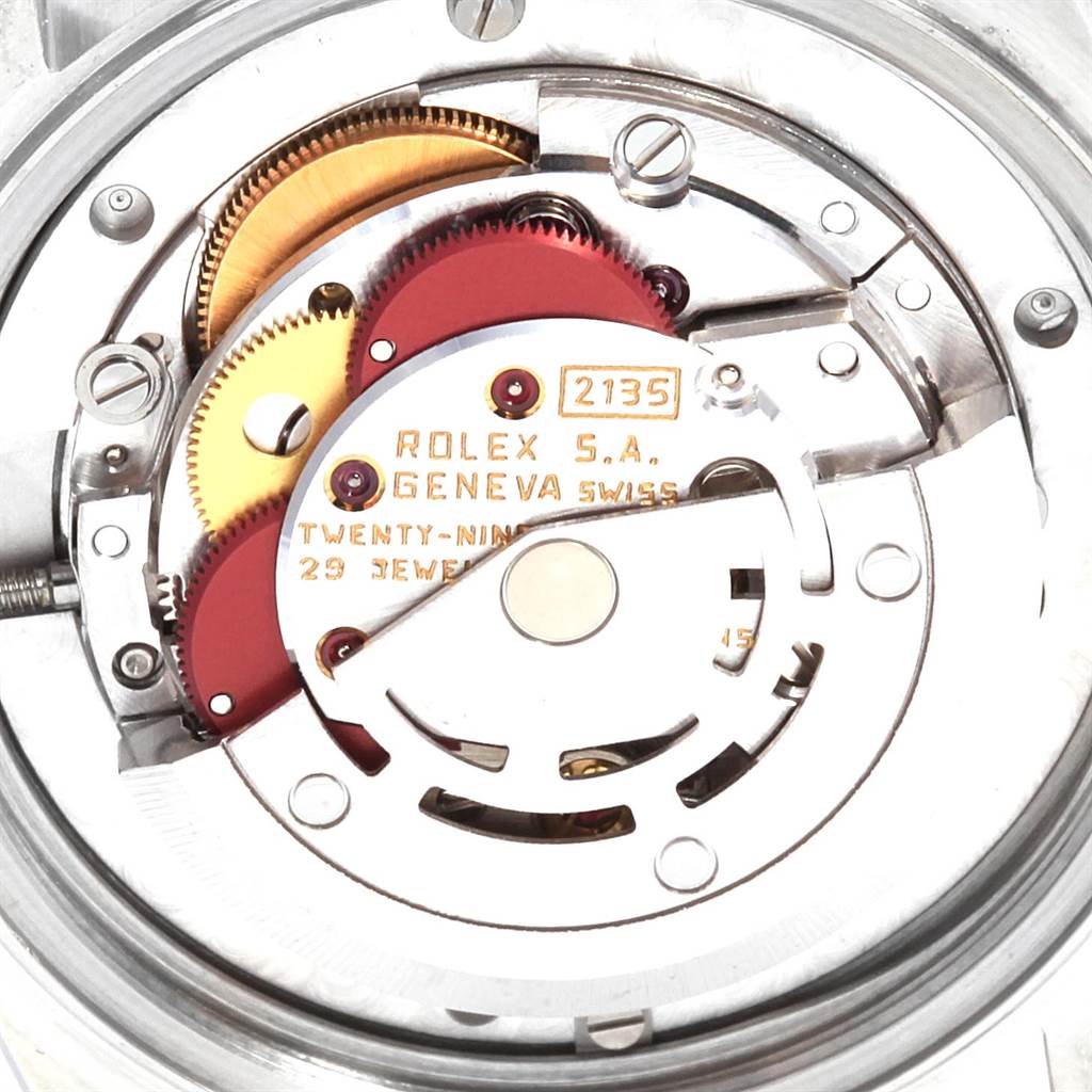 This image shows a close-up view of the internal mechanism of a Rolex Mid-Size 68273 Women's Steel and Gold (two tone) Champagne Dial 68273 Women's Steel and Gold (two tone) Champagne Dial model watch, highlighting gears and components.