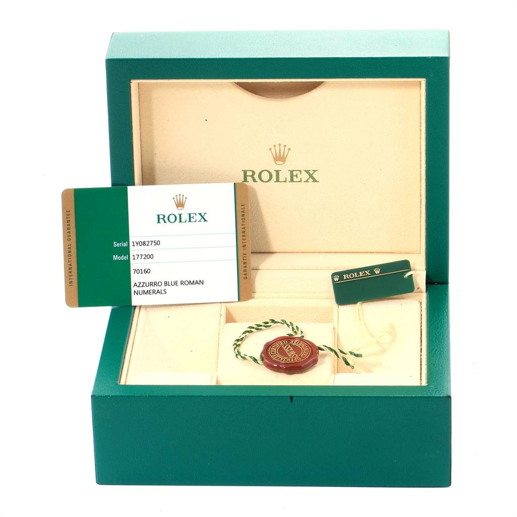 The image shows an open Rolex watch box, guarantee card, and accessories for a Mid-Size model.