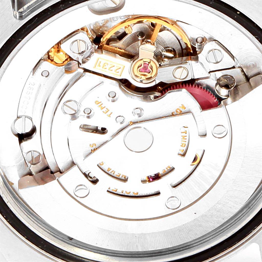 This image shows the internal mechanical movement of a Mid-Size Rolex watch viewed from the back.