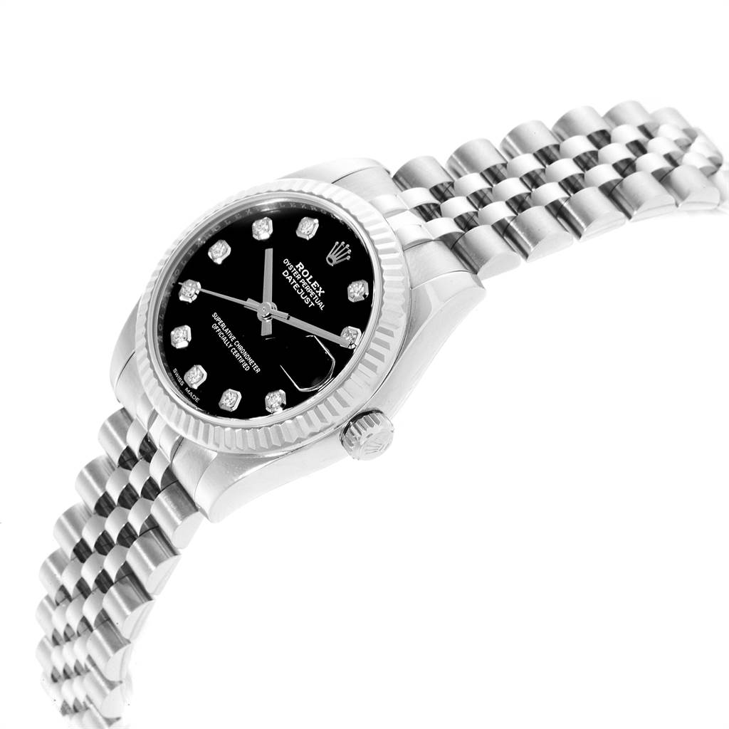 The image shows a tilted side view of a Rolex Mid-Size 178274 Women's Stainless Steel Black Dial 178274 Women's Stainless Steel Black Dial watch displaying its dial, bezel, crown, and part of the bracelet.