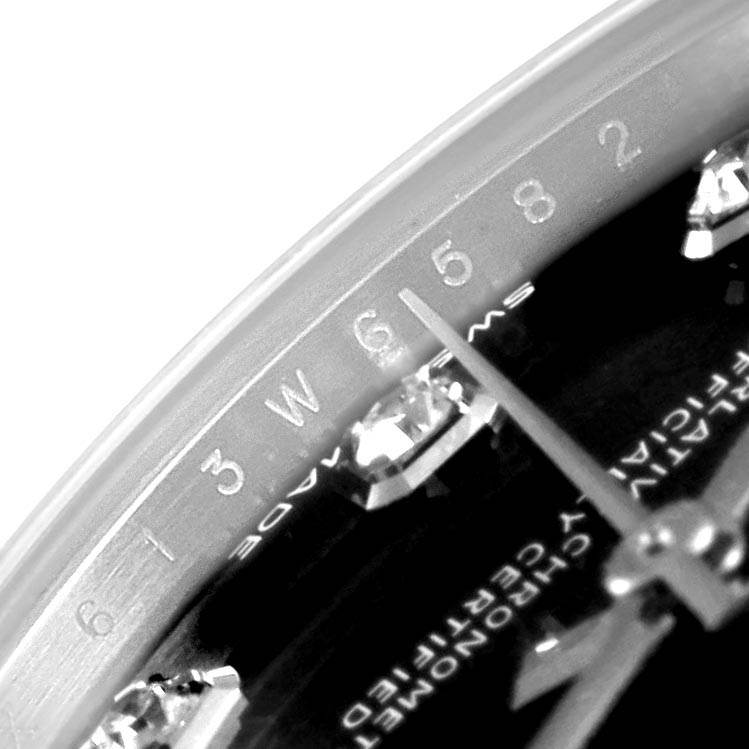 The close-up angle shows the dial, hour markers, and hands of a Mid-Size Rolex watch.