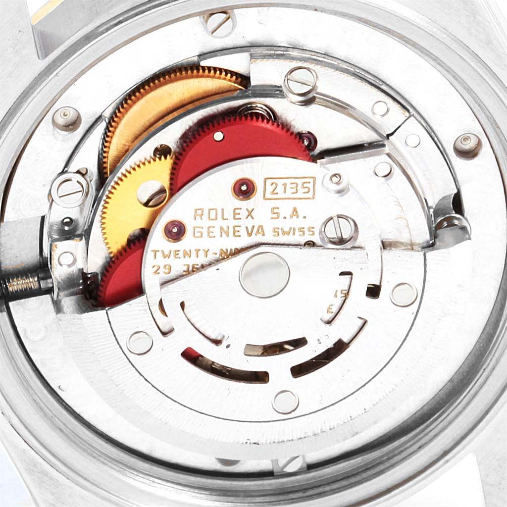 The image shows the internal mechanism of a Rolex Mid-Size 68273 Women's Steel and Gold (two tone) Champagne Dial 68273 Women's Steel and Gold (two tone) Champagne Dial watch, specifically focusing on the gears and movement components.