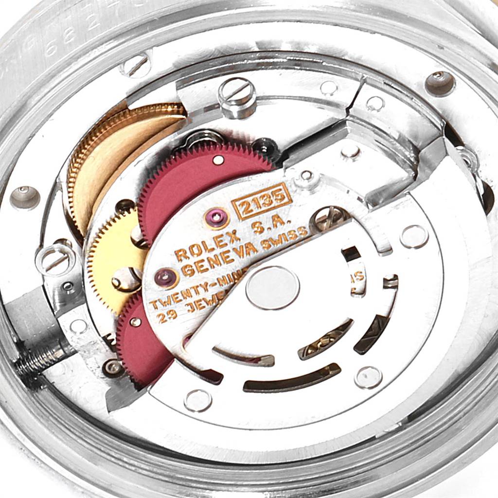 This image shows an internal view of the movement mechanism in a Mid-Size Rolex watch model 2135.