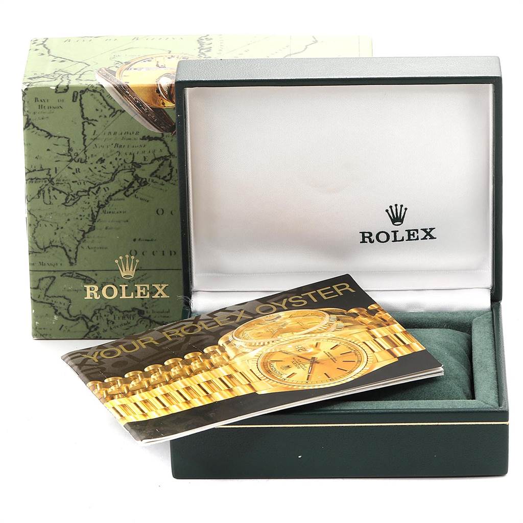 The image shows a Rolex box for a Mid-Size model, an empty watch pillow, and a Rolex booklet.