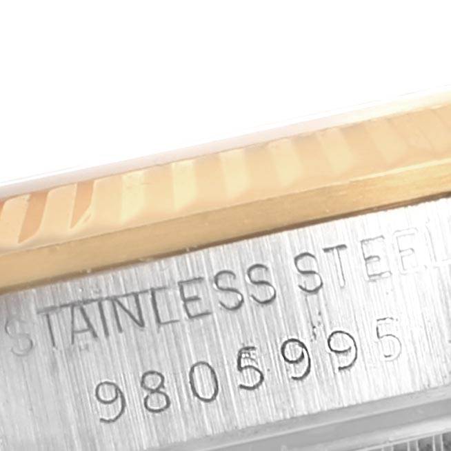 The image shows a close-up angle of the serial number and rim of a Rolex Mid-Size 68273 Women's Steel and Gold (two tone) Silver Dial 68273 Women's Steel and Gold (two tone) Silver Dial model watch.