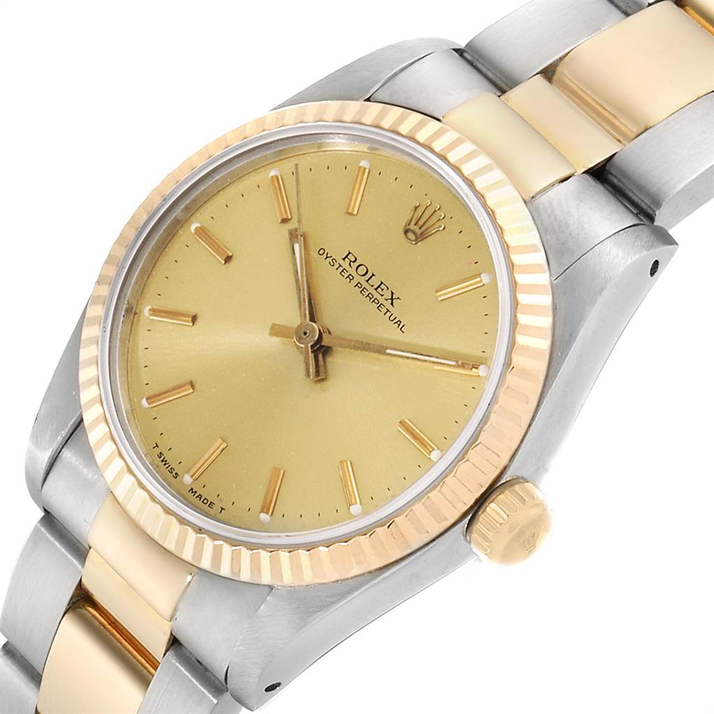 This image shows a close-up angle of the Rolex Oyster Perpetual Mid-Size model, focusing on the dial, bezel, and part of the bracelet.