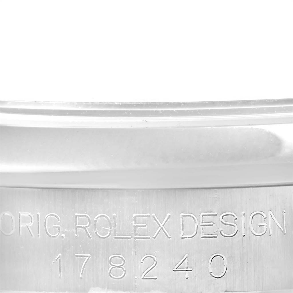 The image shows a close-up of the Rolex Mid-Size 178240 Women's Stainless Steel White Dial 178240 Women's Stainless Steel White Dial model's case engraving, displaying "ORIG. ROLEX DESIGN 178240".