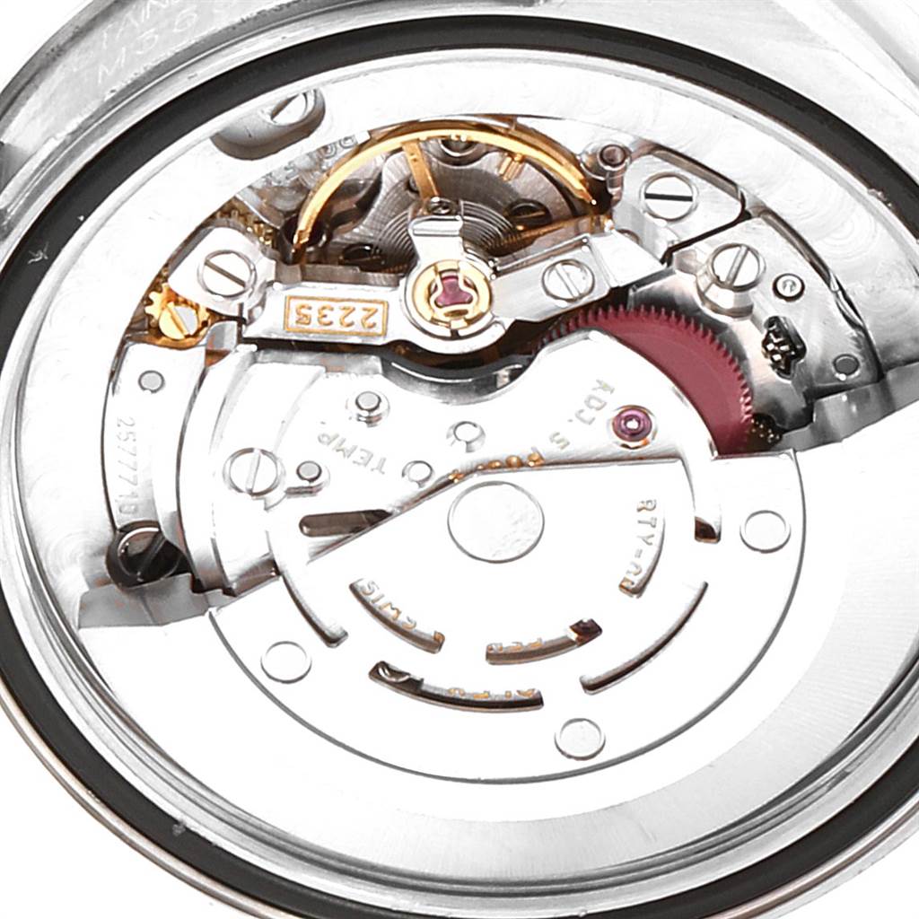 This image shows the movement parts of a Mid-Size Rolex watch from a close-up, back angle.