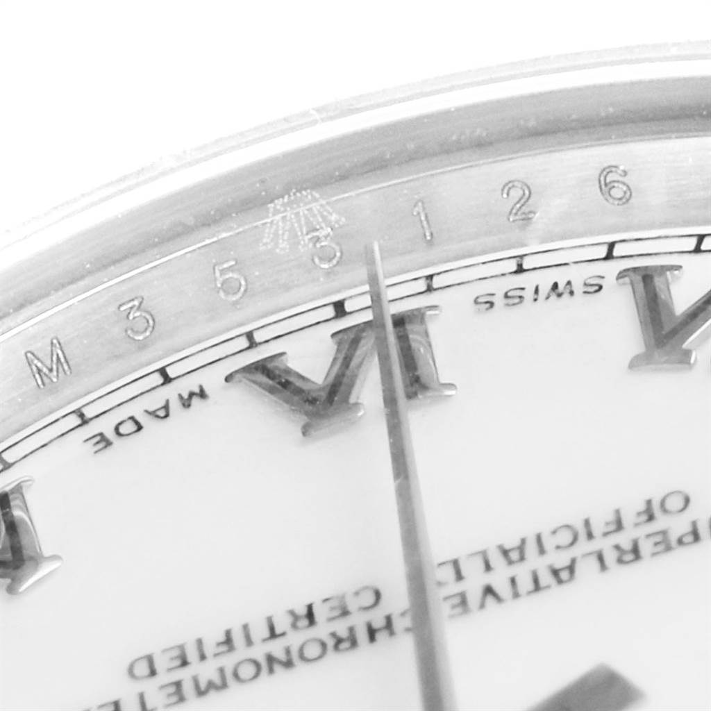The image shows a close-up of the Mid-Size Rolex watch dial, highlighting the 7-8 hour markers and the surrounding bezel.