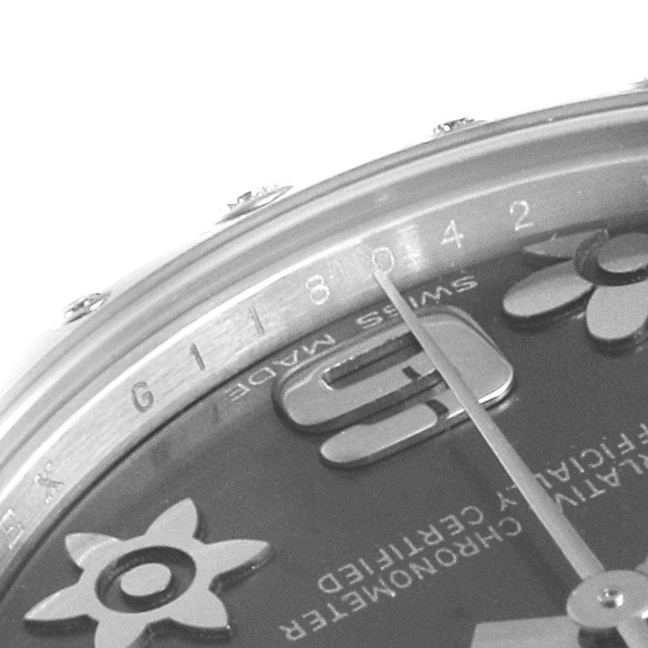 This close-up image of a Rolex Mid-Size 178344 Women's Stainless Steel Grey Dial 178344 Women's Stainless Steel Grey Dial watch shows the dial, part of the bezel, and the hour hand at an angled view.