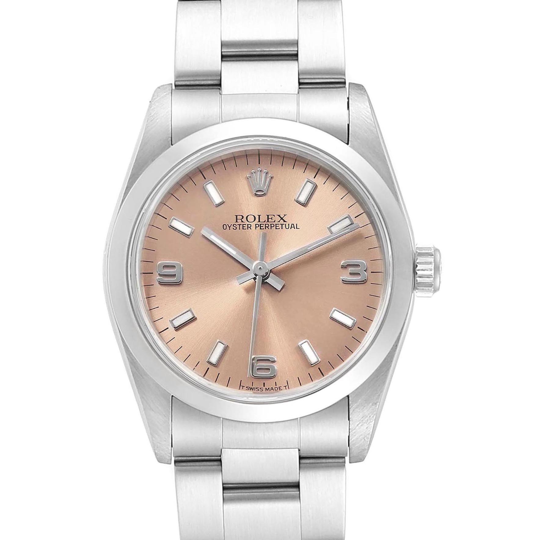 The image shows a front view of the Rolex Mid-Size 67480 Women's Stainless Steel Pink Dial 67480 Women's Stainless Steel Pink Dial Oyster Perpetual watch, highlighting its dial, bezel, and bracelet.